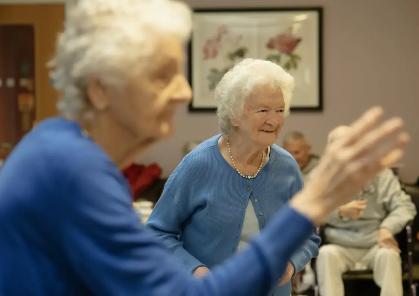 Two older women talking together.